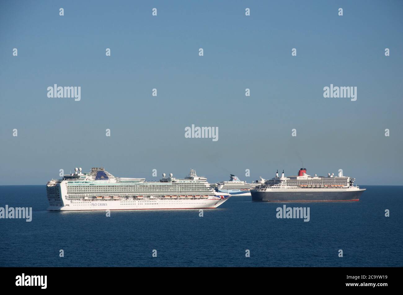 Cruise ships: Azura, Queen Mary 2, and Marella Explorer 2 anchored in Weymouth Bay. Mothballed during the Covid-19 pandemic. Dorset coast, England, UK. Stock Photo