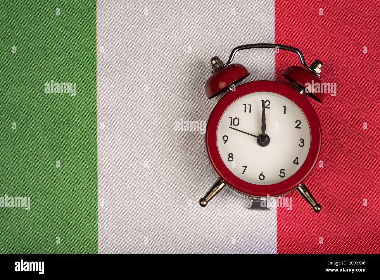 Italy flag and vintage alarm clock close up. Time to learn Italy Stock ...