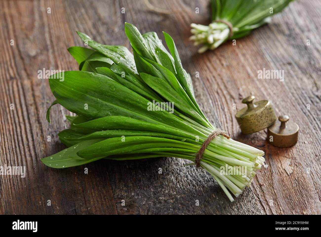 Wild garlic leafs on wood table Stock Photo