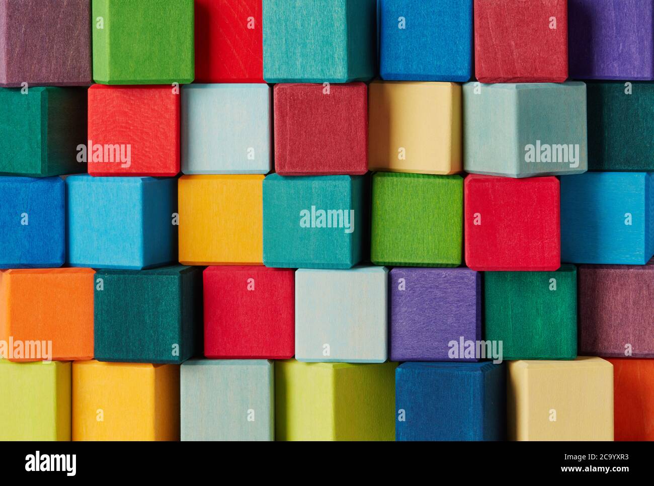 Multi-colored wooden toy blocks background Stock Photo