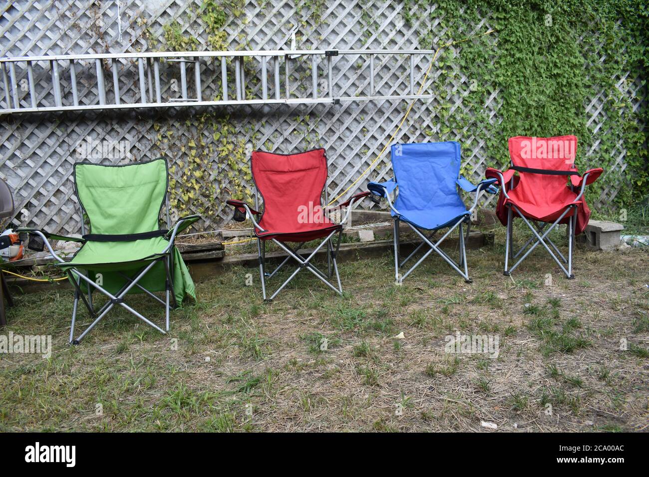 Four Lawn Chairs in a Yard Stock Photo
