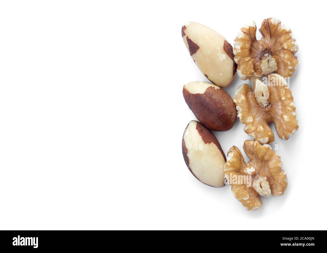 Three brazil nuts and walnuts on a white background Stock Photo
