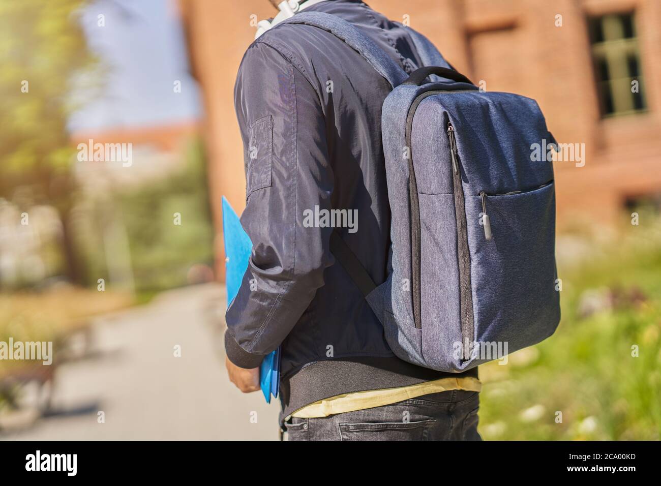 Back midsection of male student in the campus Stock Photo