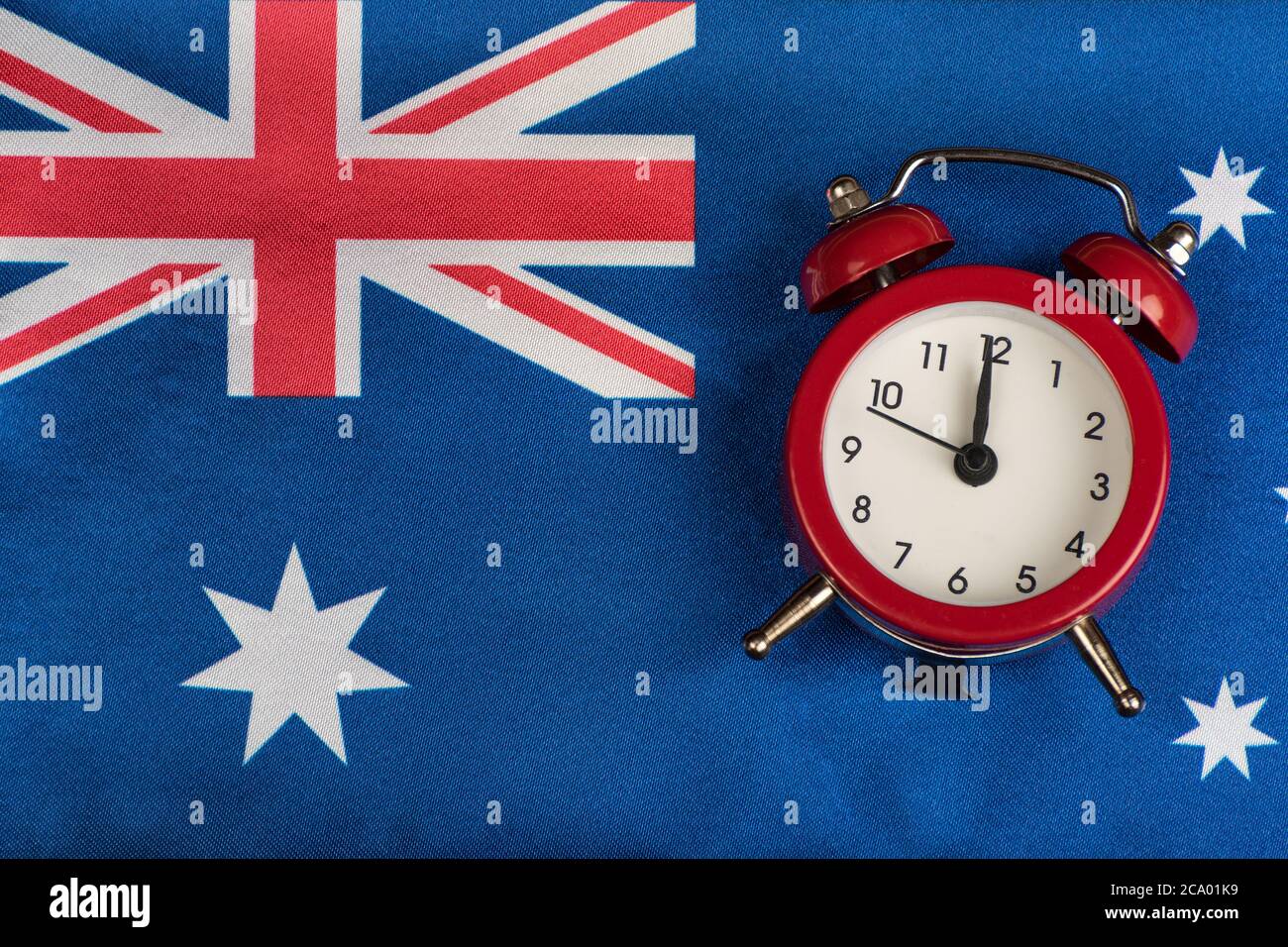 Australia flag and vintage alarm clock. Time learn English. Australian Stock Photo - Alamy