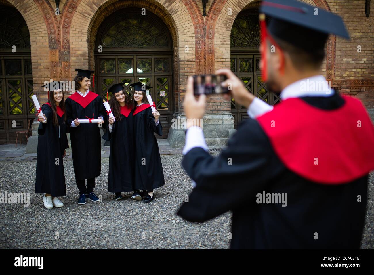 Group of students taking a picture in their graduation Stock Photo - Alamy