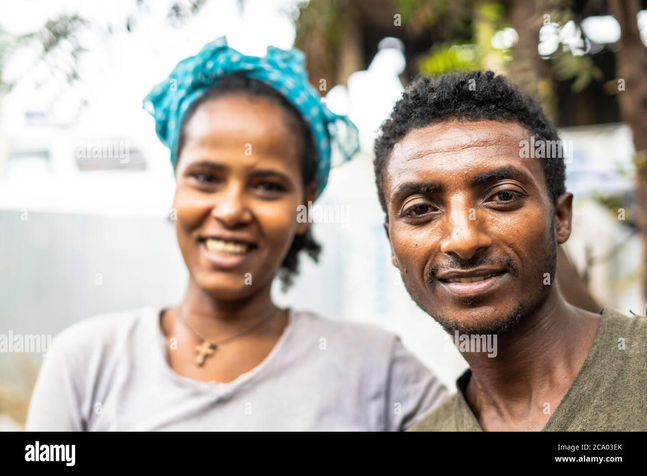 Portrait of young smiling man and woman, Berhale, Afar Region, Ethiopia, Africa Stock Photo