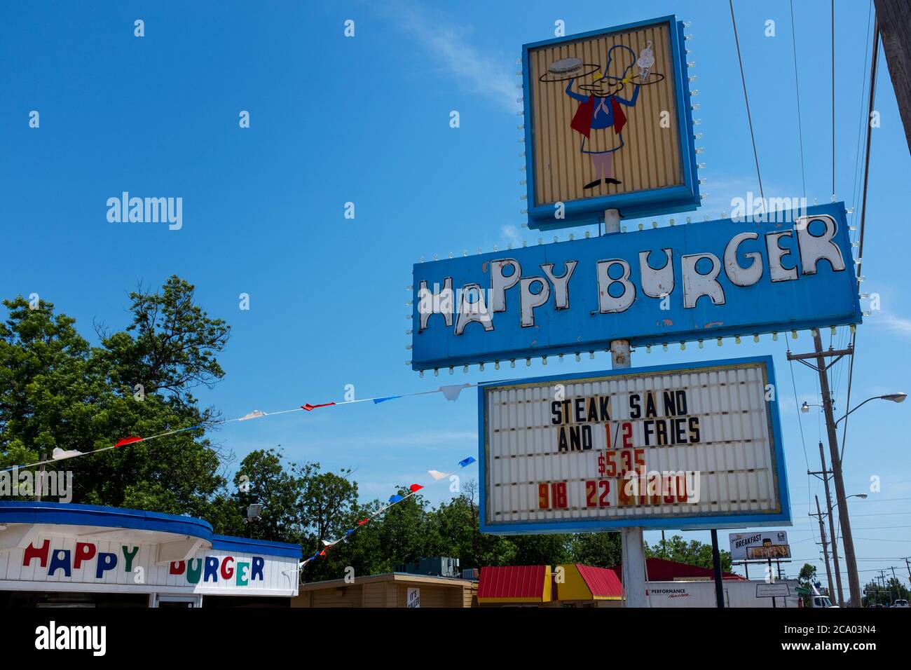 Clinton, Oklahoma, USA July 8, 2014 The sign for the Happy Burger