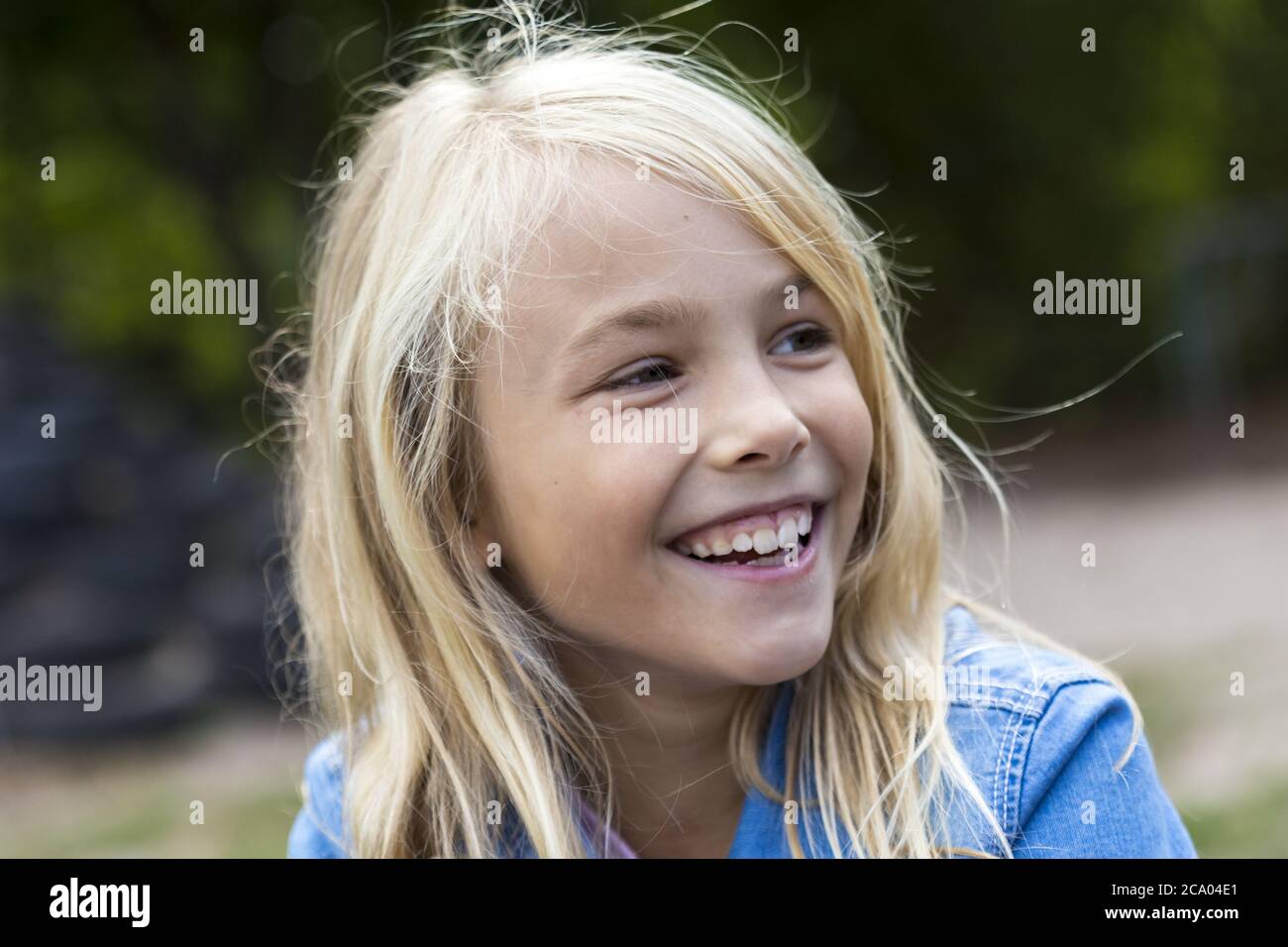 Girl (10) smiles, Kiel, Schleswig-Holstein, Germany Stock Photo