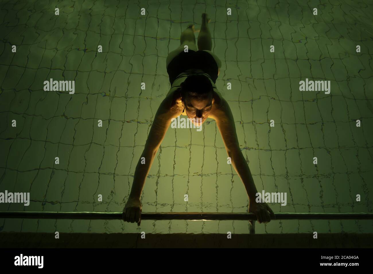 Woman in swimming pool night hi-res stock photography and images - Alamy
