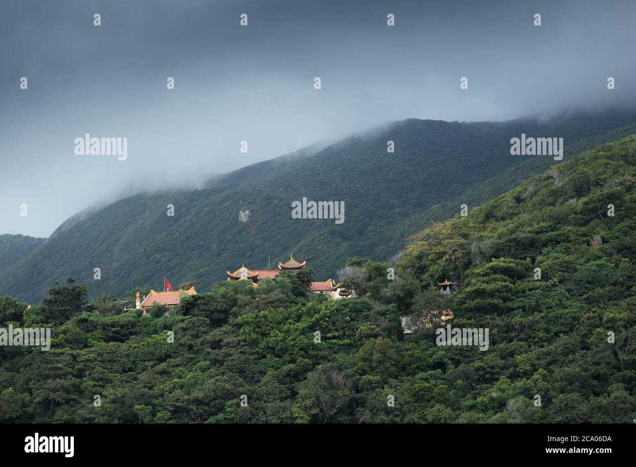 Con Dau, island from Vietnam, Van Son Pagoda in mountains with storm clouds Stock Photo