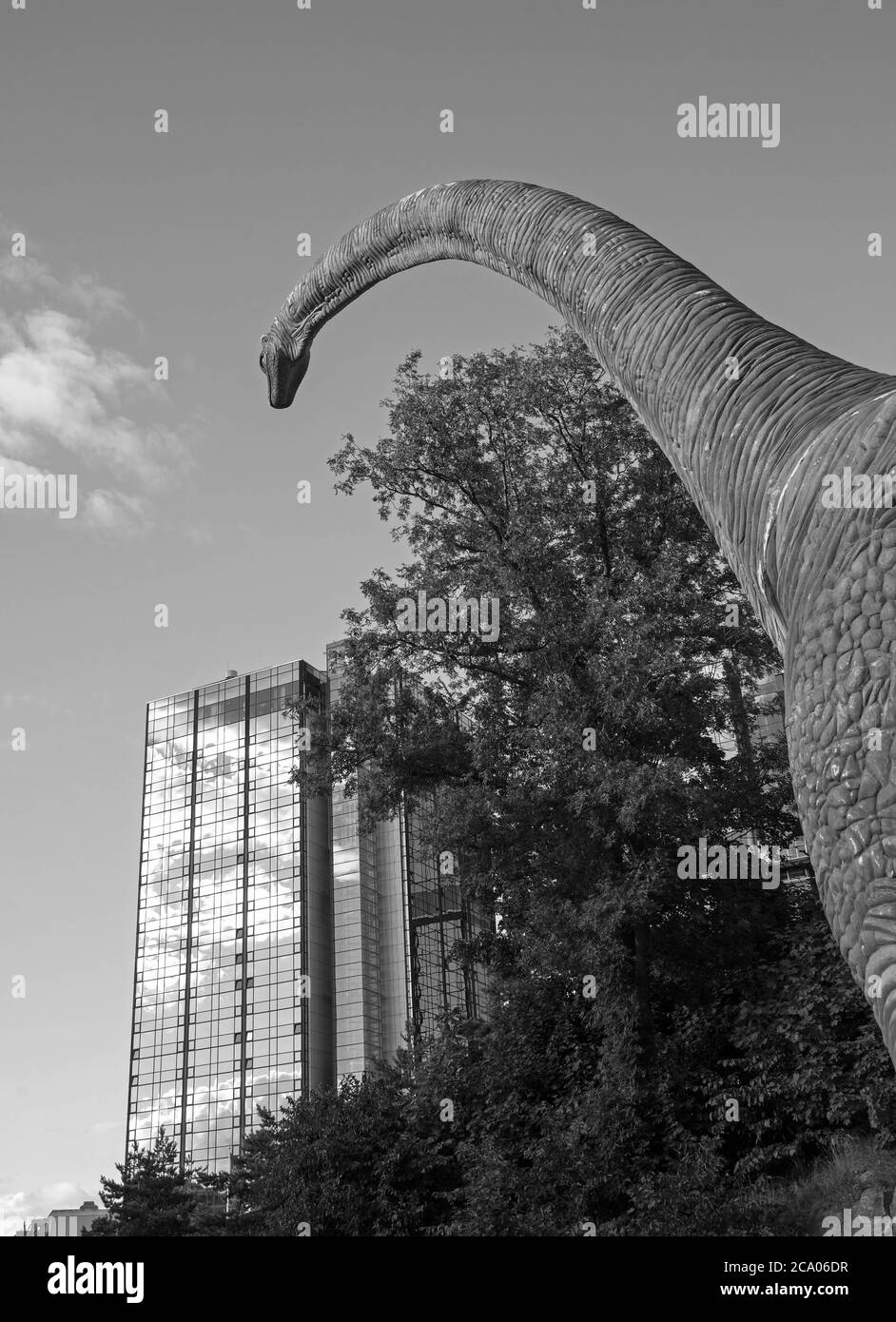 A dinosaur is looking towards Hotel Gothia Towers in Gothenburg. Dinosaur exhibition at Universeum. Photo Jeppe Gustafsson Stock Photo