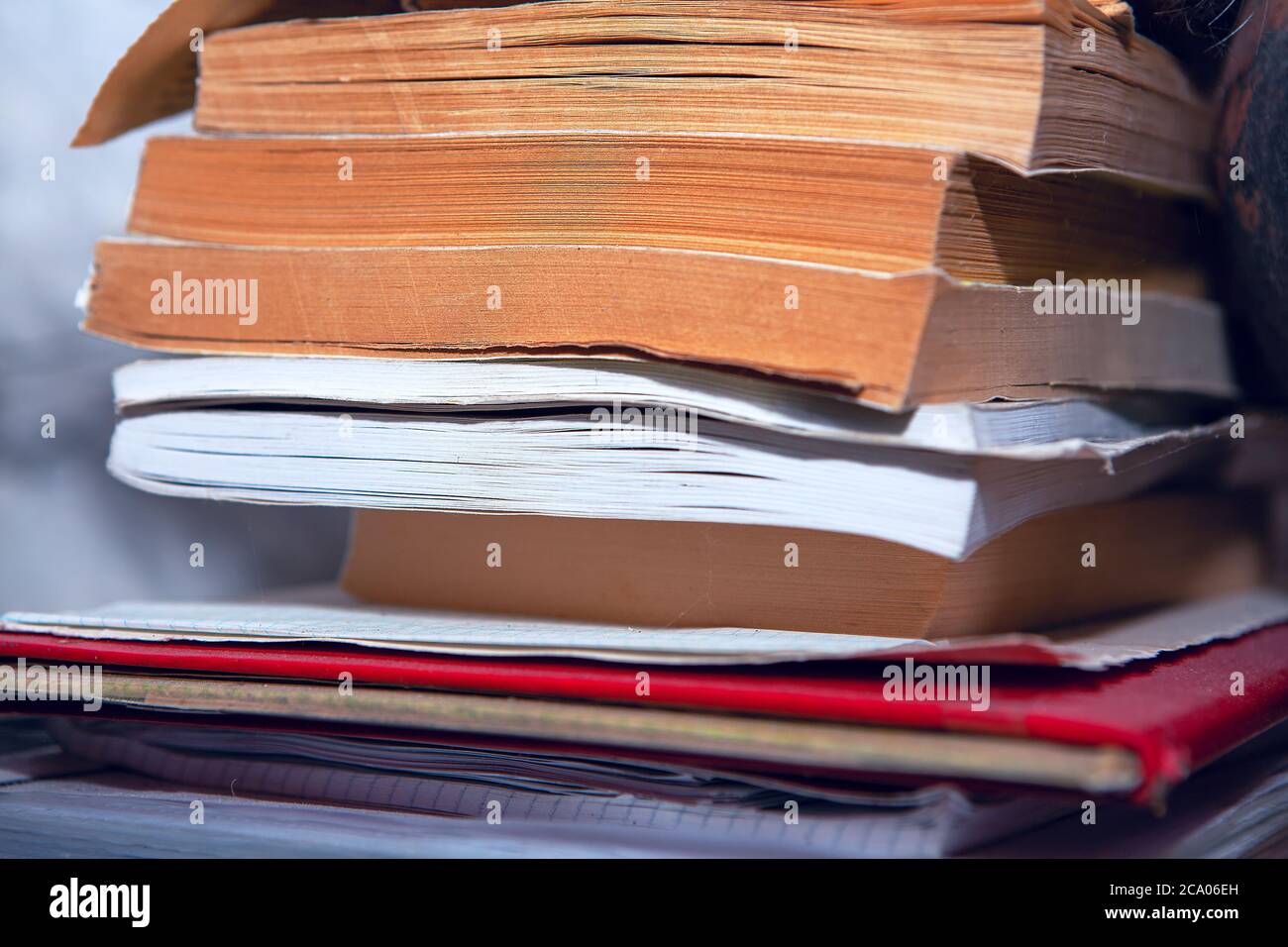 Side view of stack of books Stock Photo - Alamy