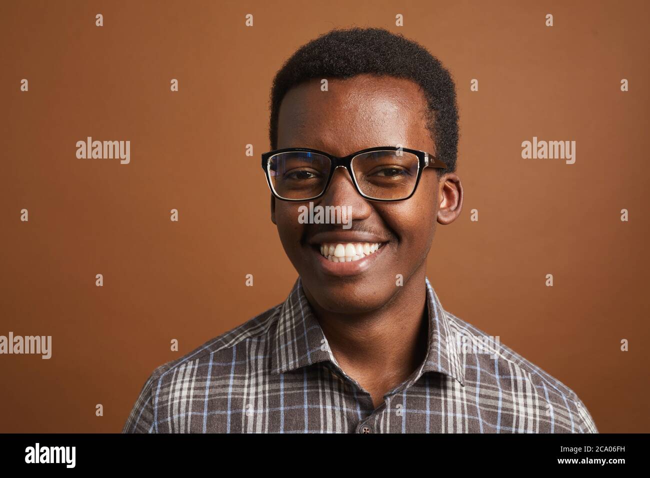 Minimal head and shoulders portrait of young African-American man ...