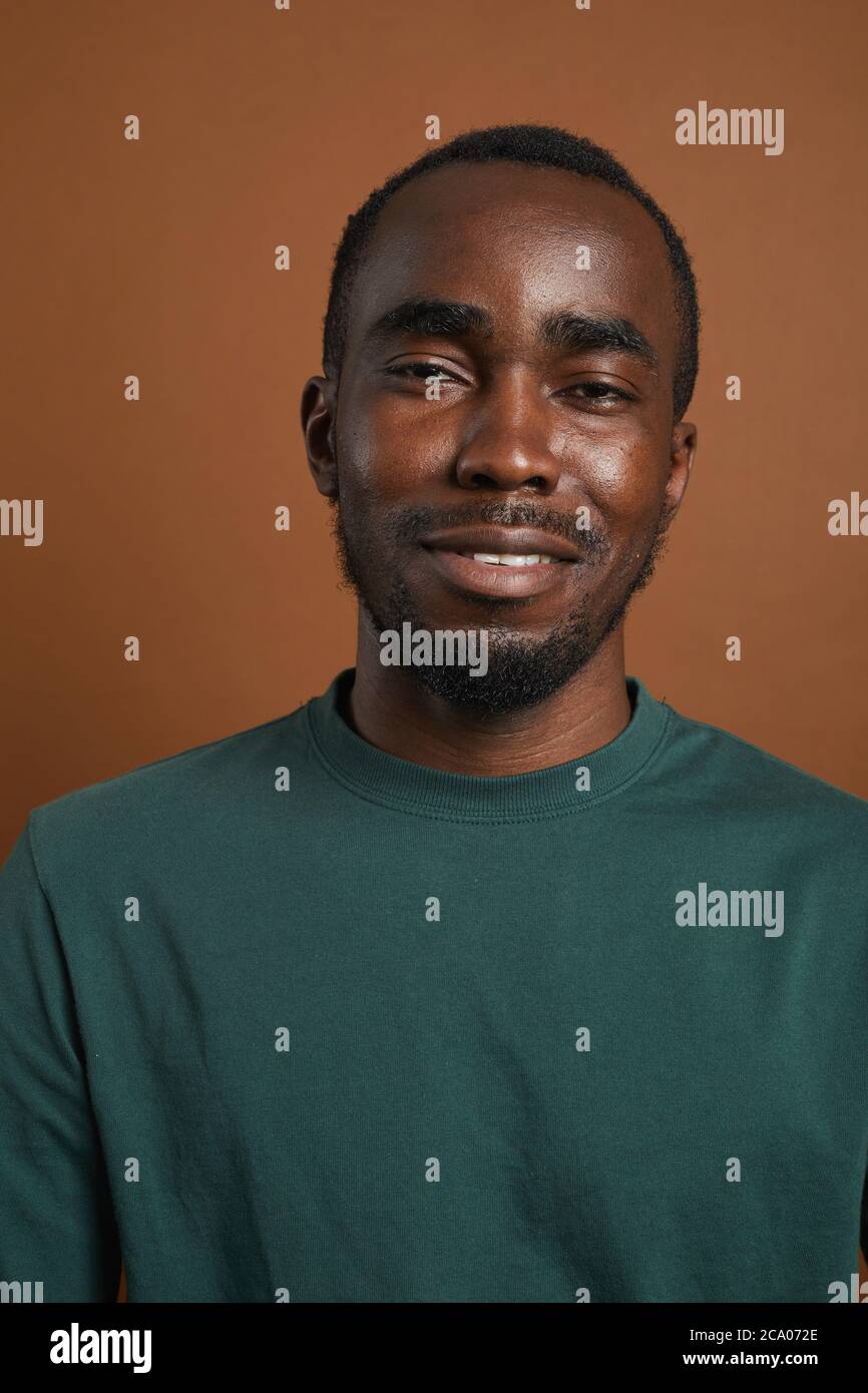 Minimal head and shoulders portrait of young African-American man ...