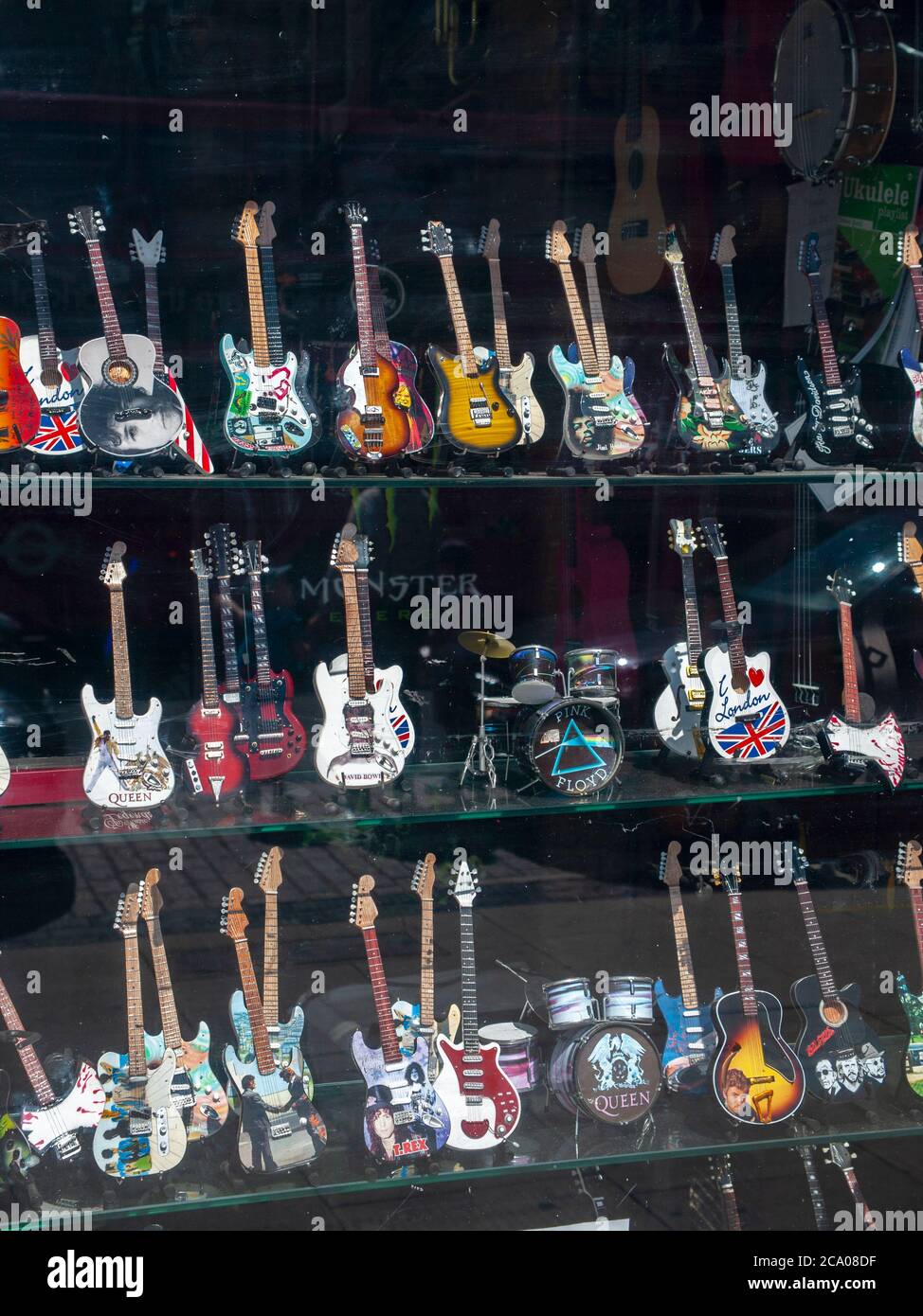 Miniature guitars in a guitar shop window display, Camden, London, U.K. Stock Photo