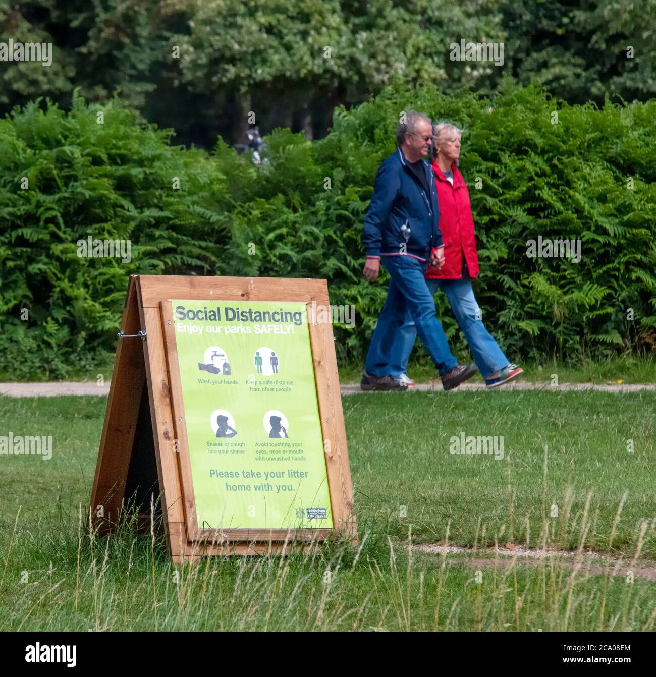 Social distancing sign on a display board in a country park,Nottingham, UK Stock Photo