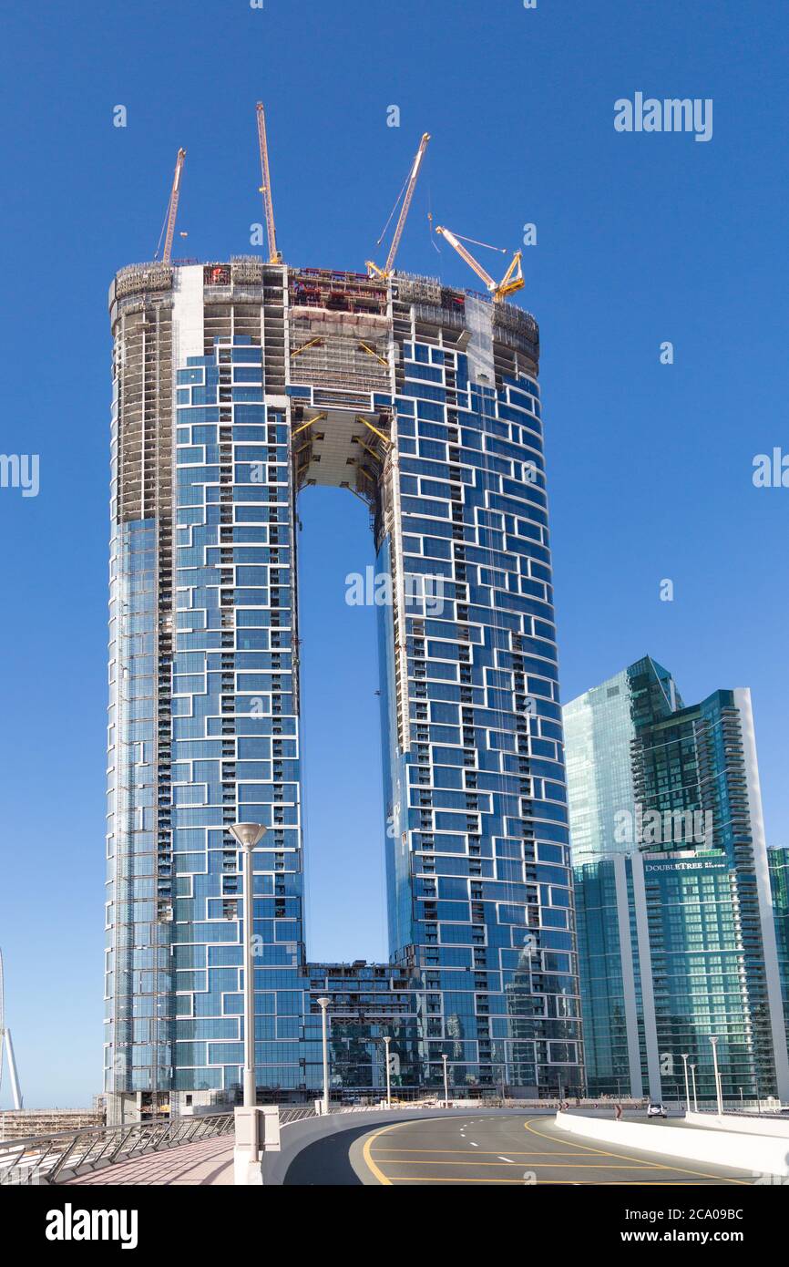 The construction of a beautiful tall building in Dubai Stock Photo
