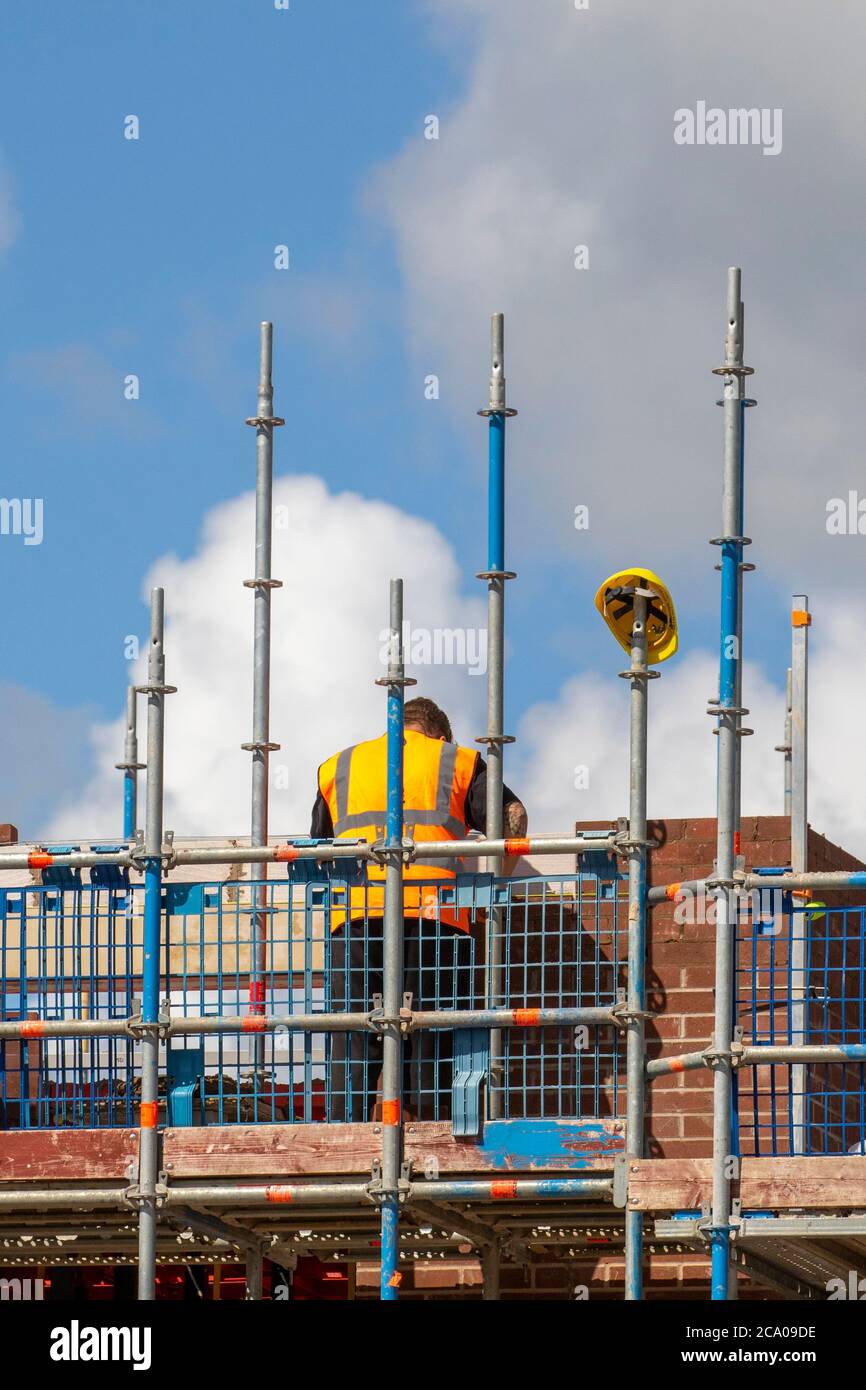 Builders working in Tarleton, Lancashire. UK Weather. Hot summer sun