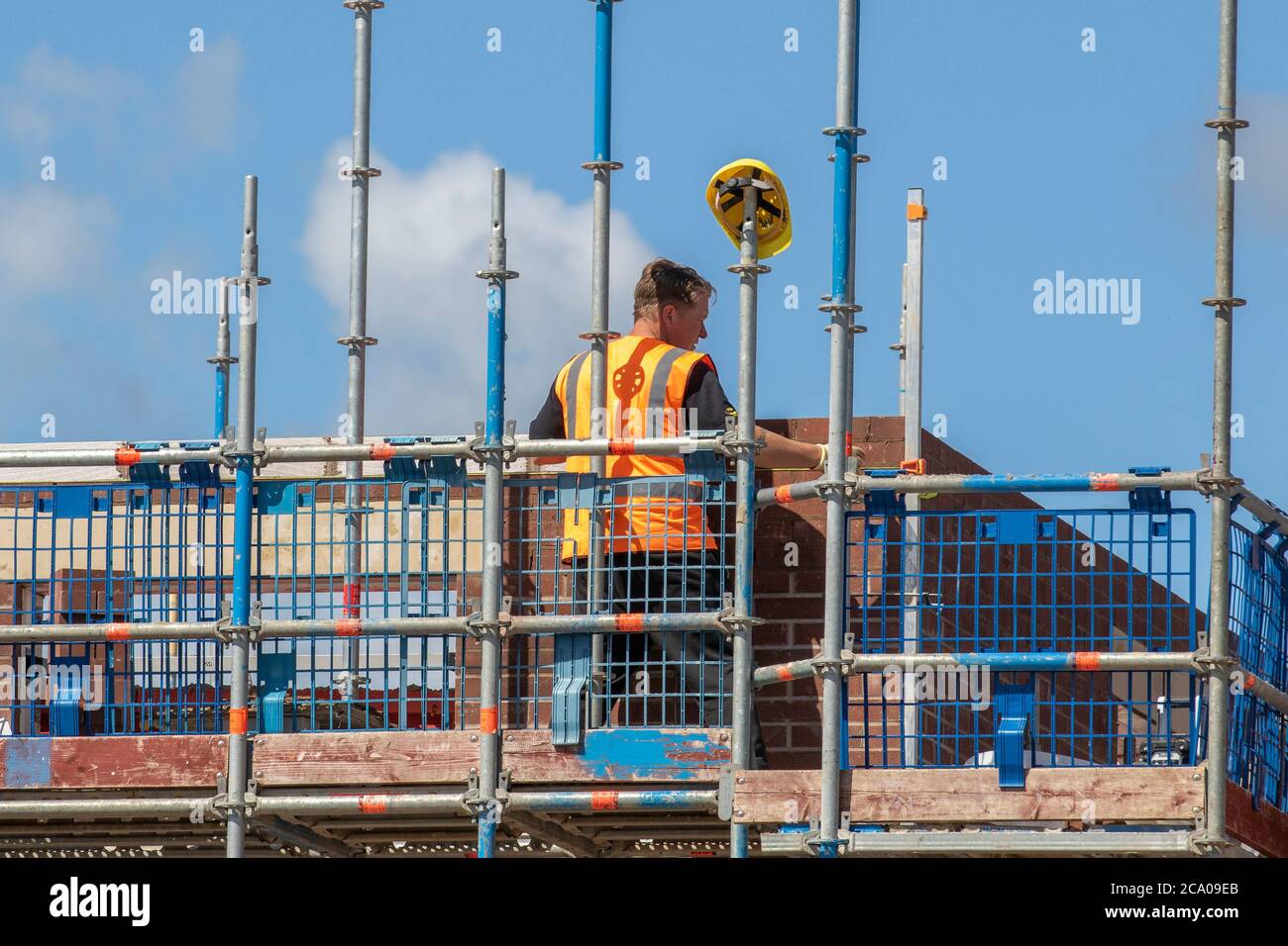 Builders working in Tarleton, Lancashire. UK Weather. Hot summer sun