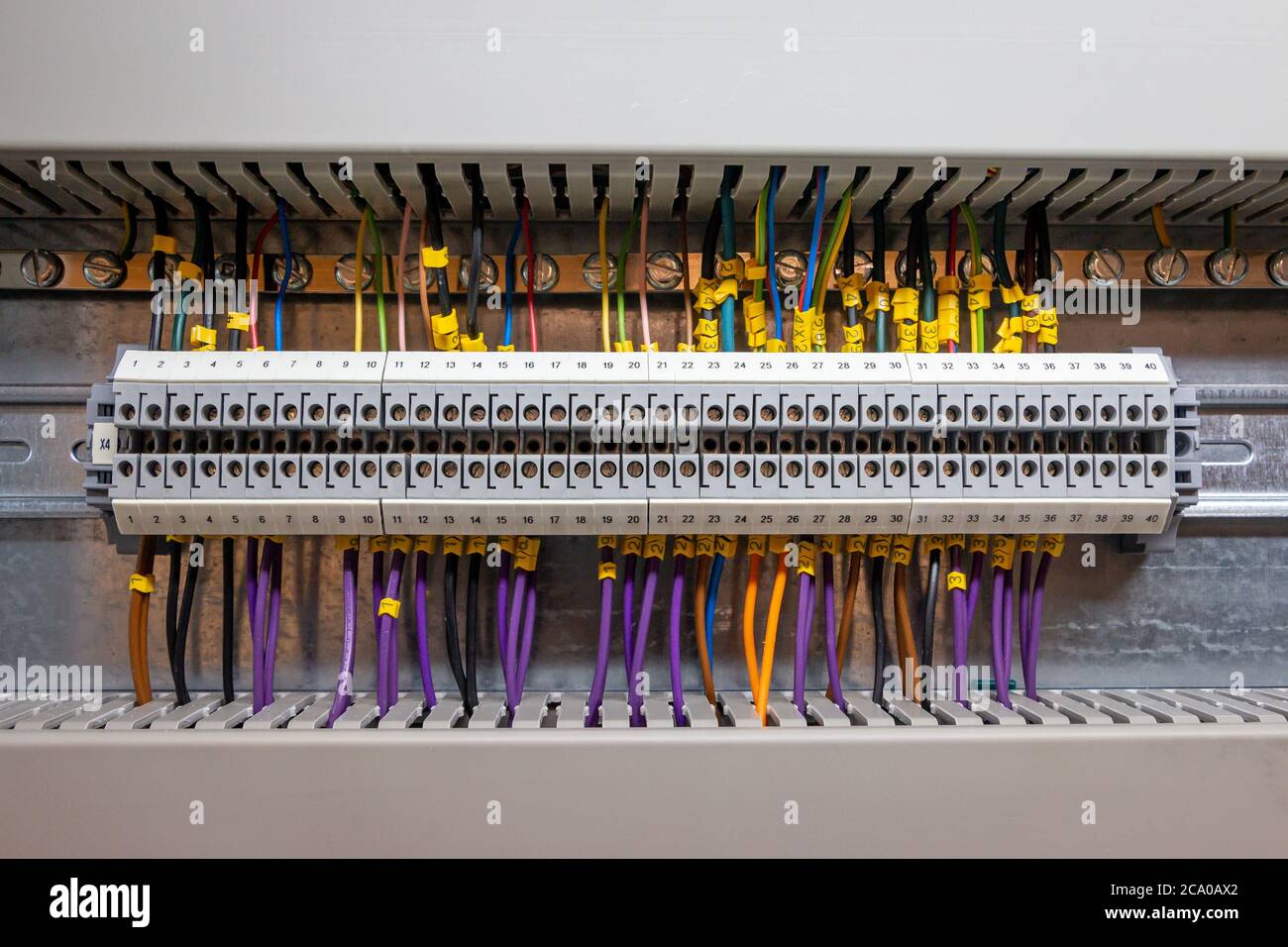 Low voltage electrical connections on a rail in a junction box for signal exchange in a computer controlled system Stock Photo