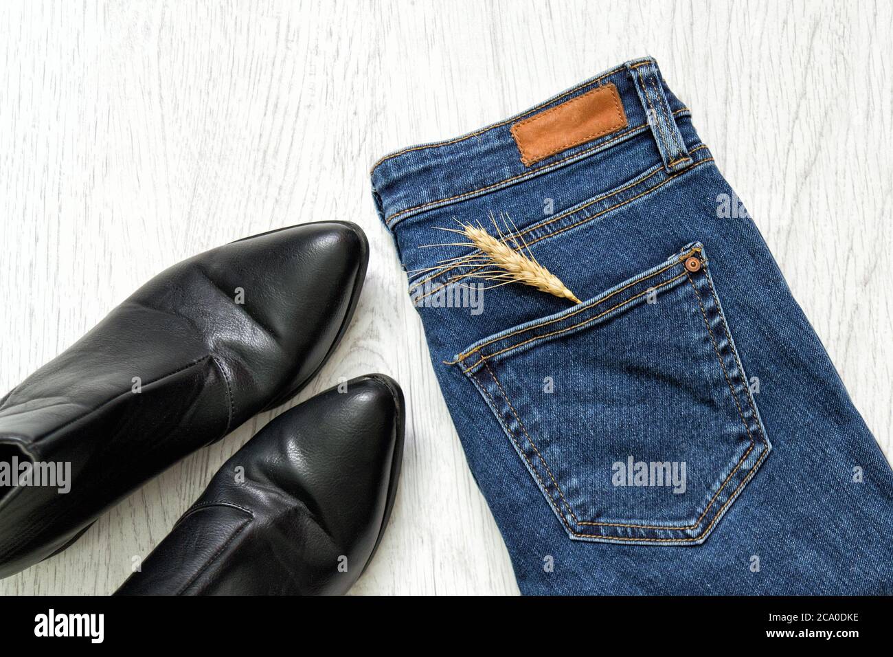 Blue jeans, black shoes and Wheat ear 