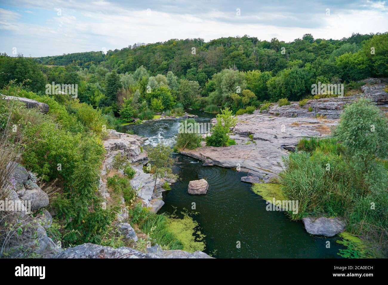 Stream flowing among stones hi-res stock photography and images - Alamy