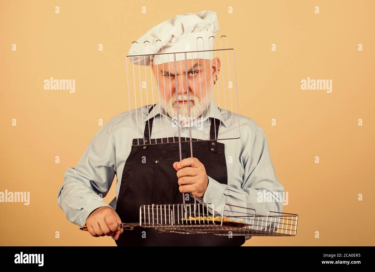 Lunch time. cook men with beard. cooking utensils for barbecue. he