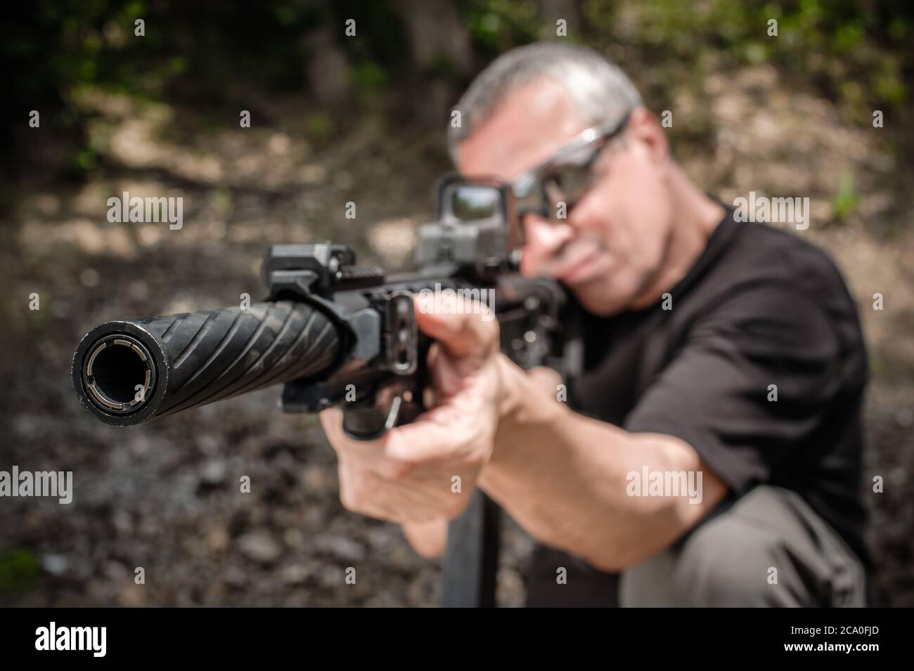 Front view gun point of rifle machine gun. Firearm shooting and