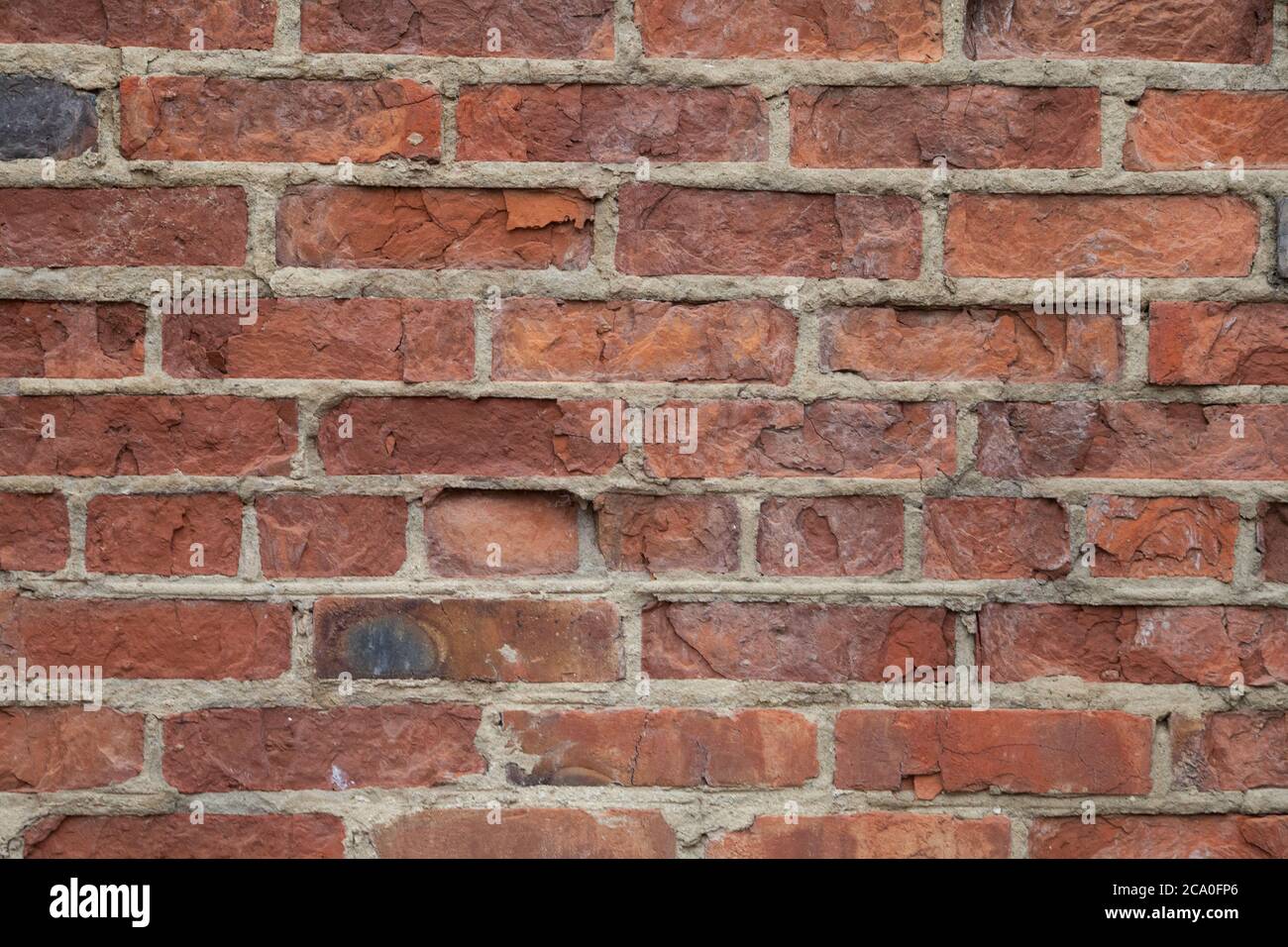 Real old brick wall crumbling from time to time Stock Photo