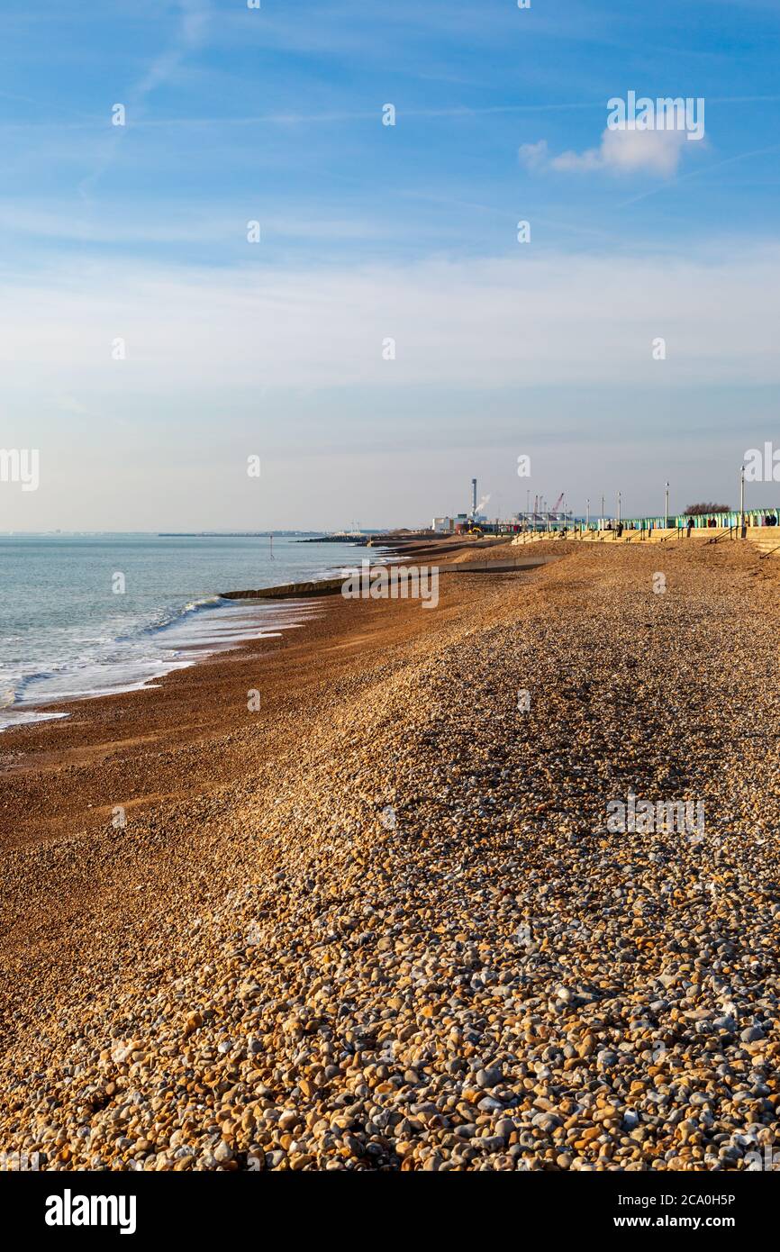 Looking along the pebble beach at Hove, towards Shoreham in the west Stock Photo