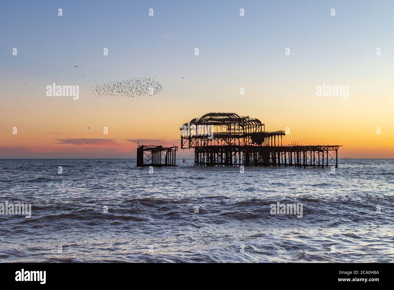 Sunset at Brighton Beach, with a Murmuration of Starlings Beside the ...