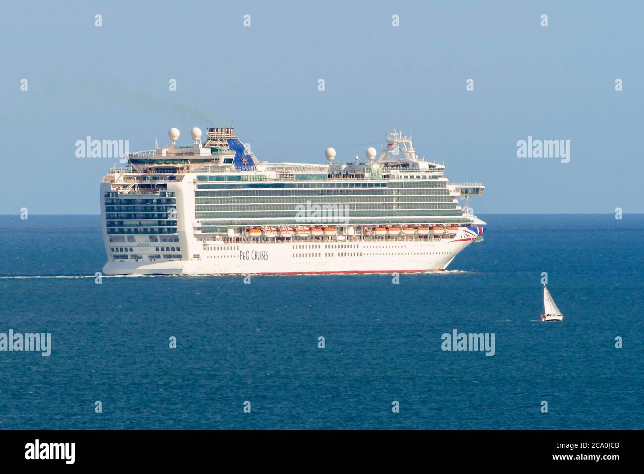 Weymouth, Dorset, UK.  3rd August 2020.  UK Weather.  Empty P&O cruise ship Azura sets sail from the bay at the seaside resort of Weymouth in Dorset on a day of hot sunny spells.  Picture Credit: Graham Hunt/Alamy Live News Stock Photo