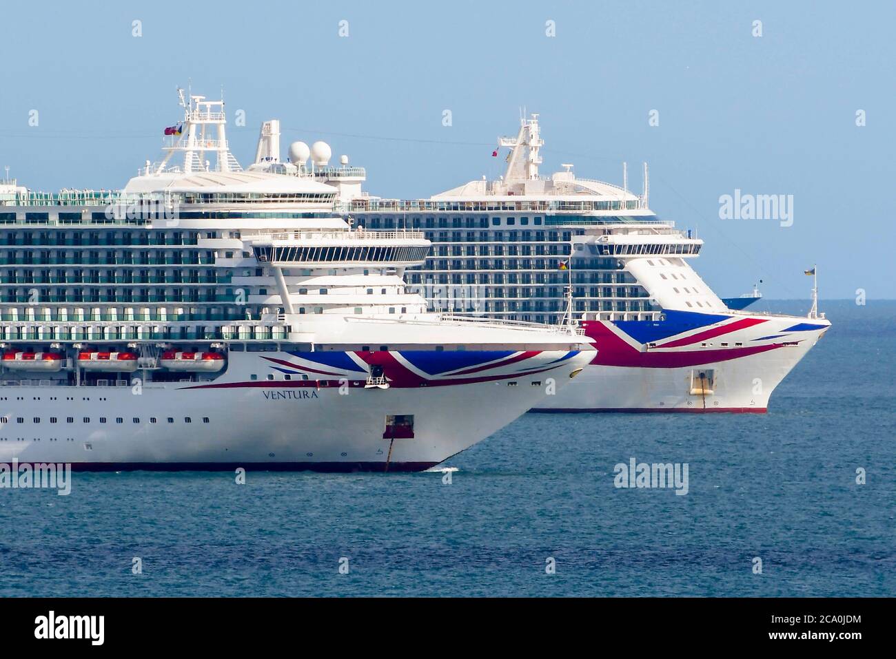 Weymouth, Dorset, UK.  3rd August 2020.  UK Weather.  Two empty P&O cruise ships Ventura and Britannia anchored in the bay at the seaside resort of Weymouth in Dorset on a day of hot sunny spells.  Picture Credit: Graham Hunt/Alamy Live News Stock Photo