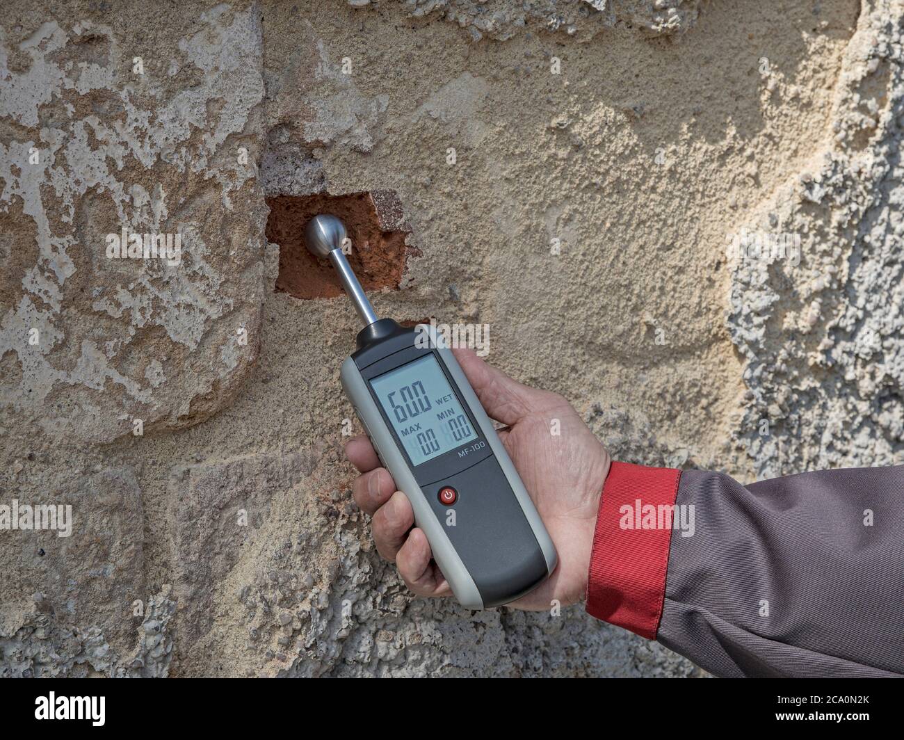Measuring humidity with moisture indicator on a wall Stock Photo Alamy