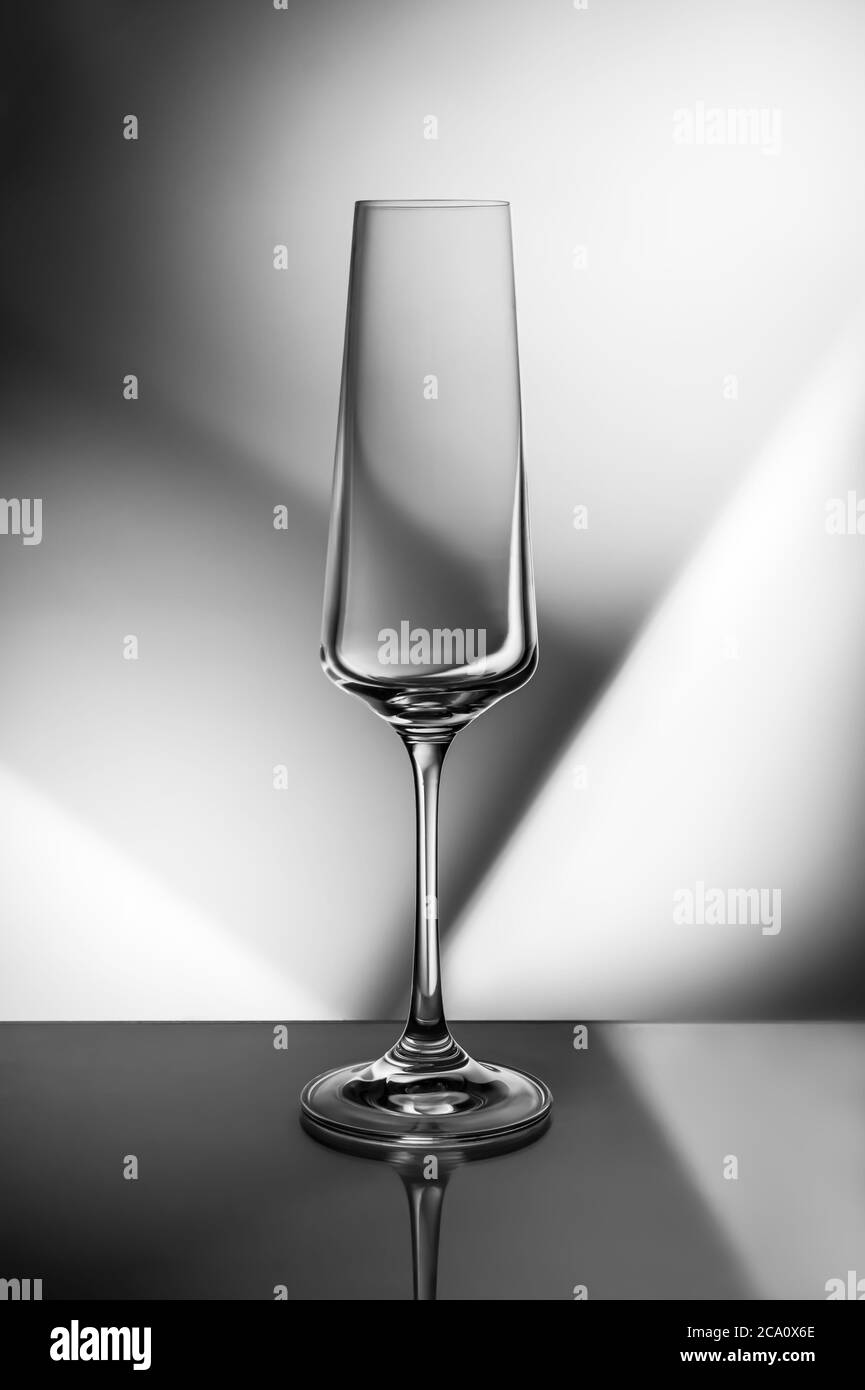 champagne glass on a black and white geometric background Stock Photo