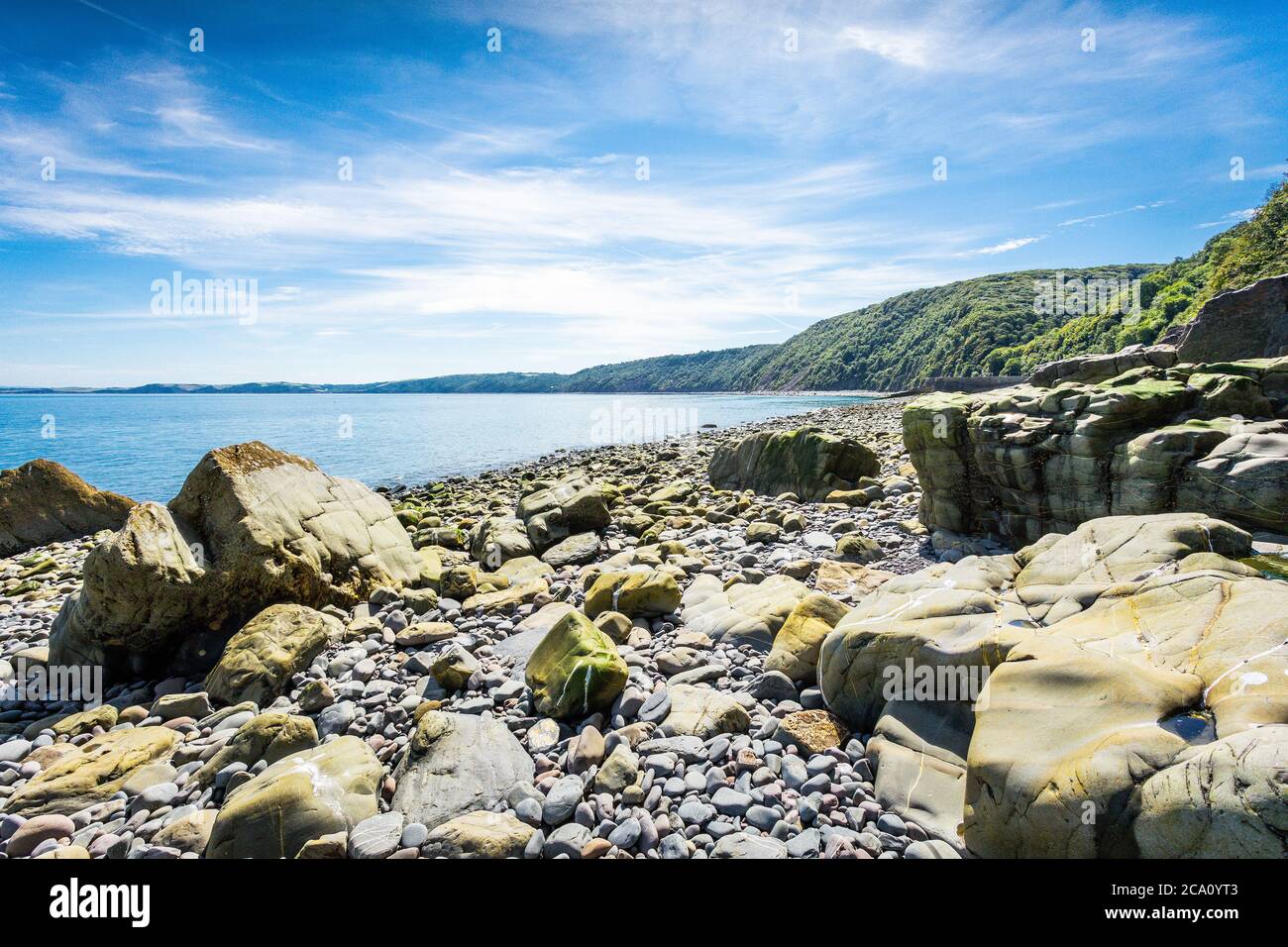 Rocky Shore In North Devon, Clovelly, Blue Sea & Sky Stock Photo