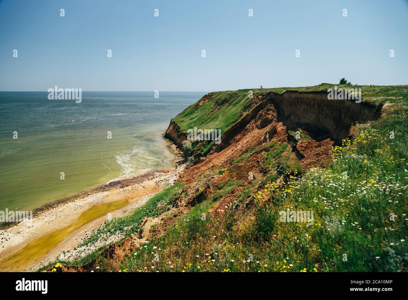 ODESSA, UKRAINE - MAY, 20 2015: People standing over the huge landslide on the coast of the Black sea Stock Photo