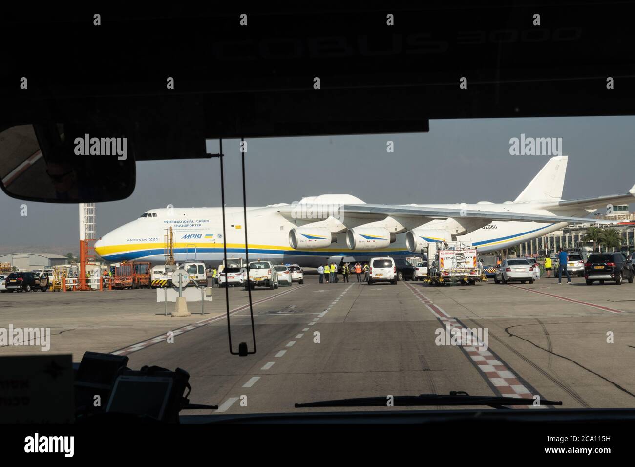 Tel Aviv, Israel. 3rd August, 2020. A Russian built Antonov AN-225 Mriya, carrying US military Oshkosh trucks to be fitted with Iron Dome missile defense systems, lands in Israel. The Israeli Ministry of Defense prepares to deliver to the US Department of Defense two Iron Dome batteries for short term needs for Indirect Fire Protection Capability for the United States Army to defend US troops against a range of ballistic and aerial threats. The AN-225 is the largest aircraft ever produced with over 30 wheels, six engines and a wingspan of 290ft. Credit: Nir Alon/Alamy Live News Stock Photo