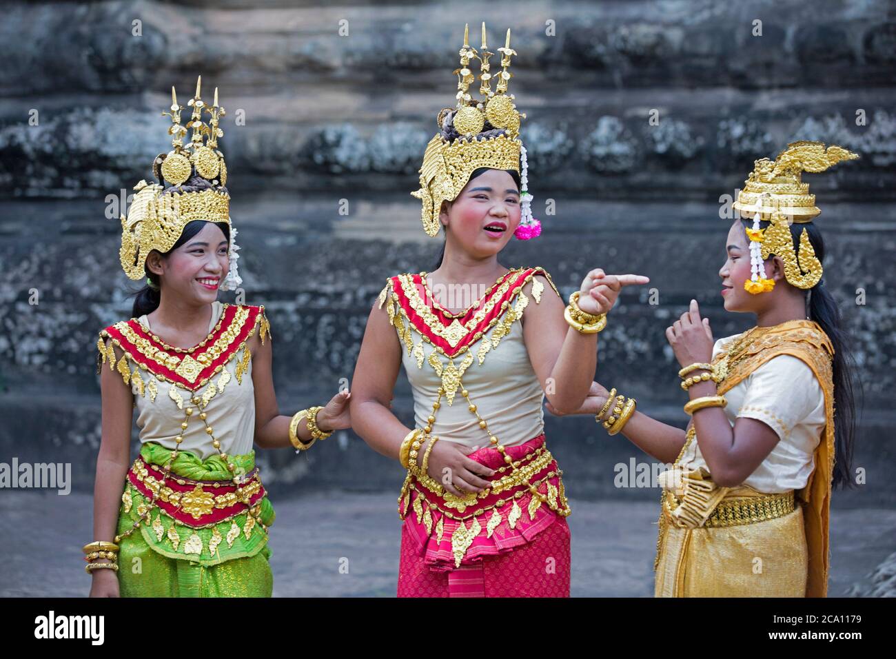 Young Cambodian dancers dressed as Apsaras in the 12th century temple complex Angkor Wat, dedicated to the god Vishnu, Siem Reap, Cambodia, Asia Stock Photo