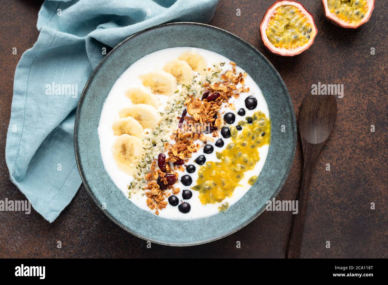 Yogurt granola bowl with fruits and hemp seeds. Healthy breakfast