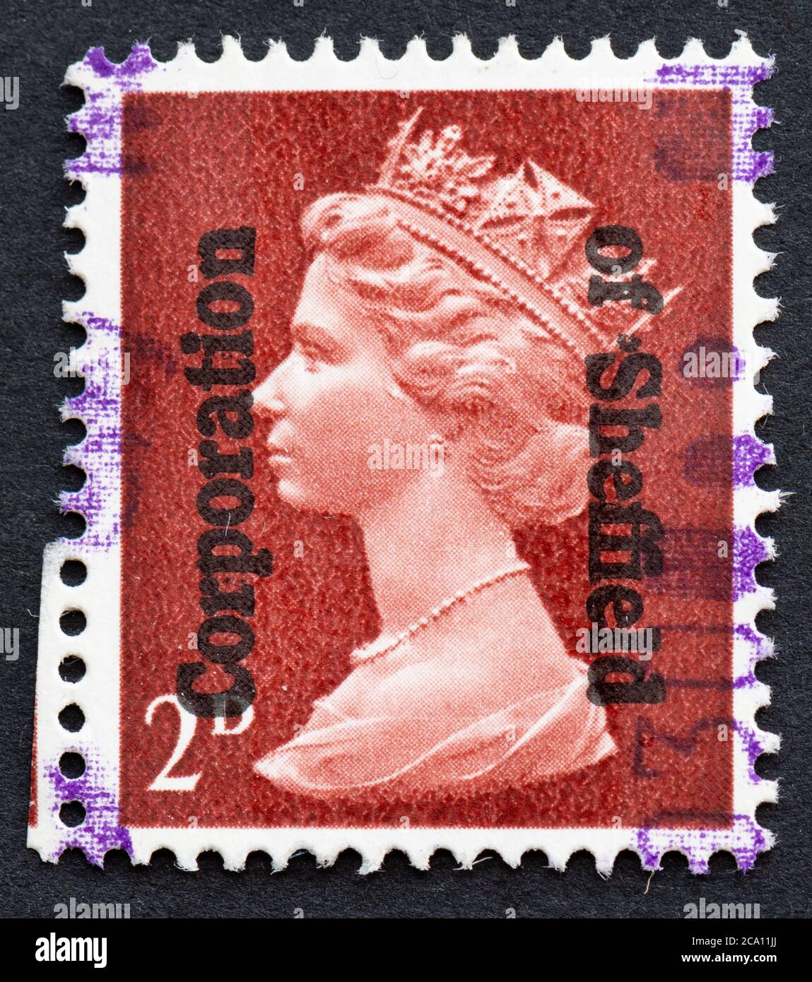 2d queen elizabeth II stamp overprinted with Corporation of Sheffield - commercial overprint stamp used for paying stamp duty - uk Stock Photo