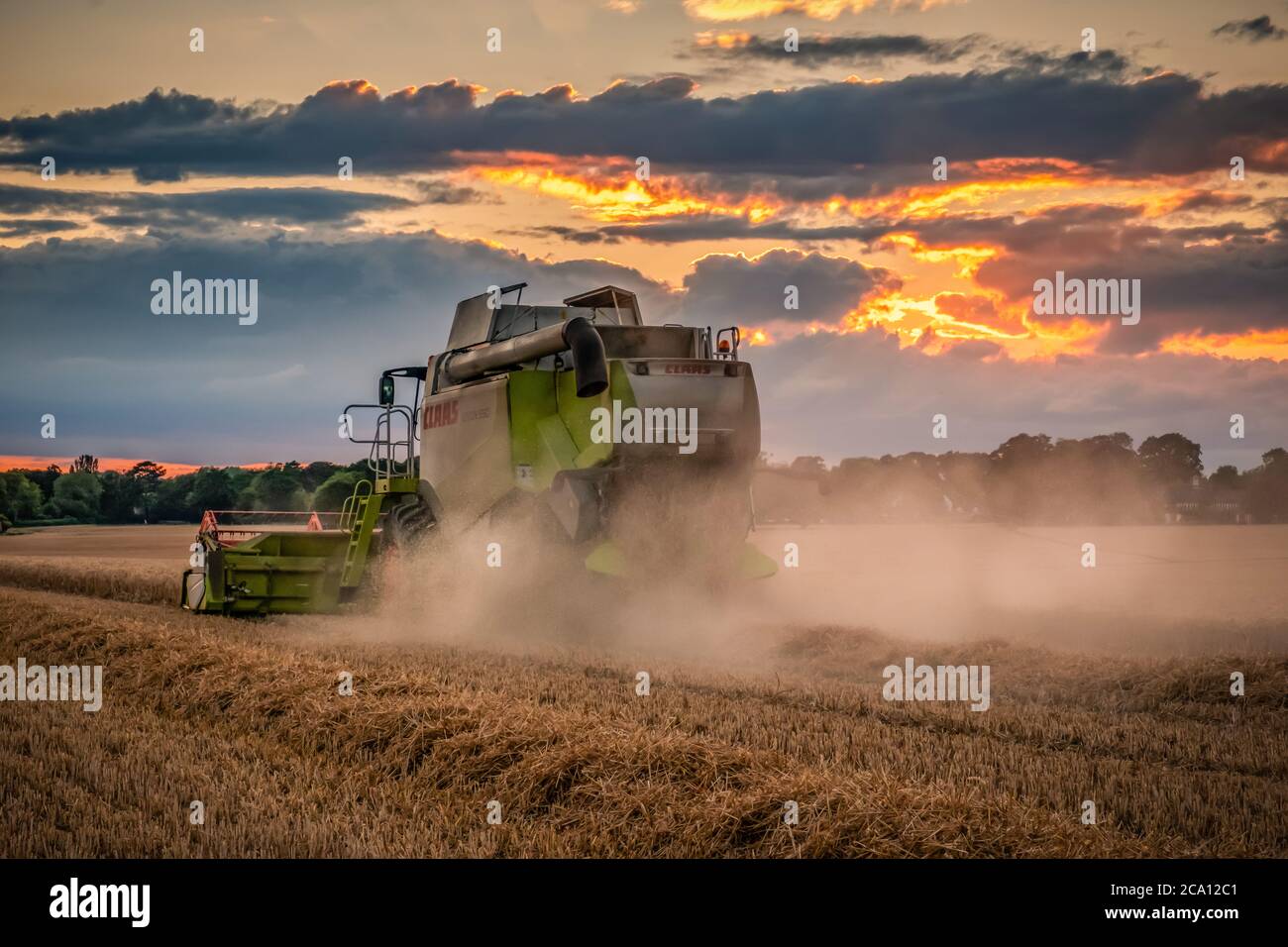 Harvester at Sunset Stock Photo