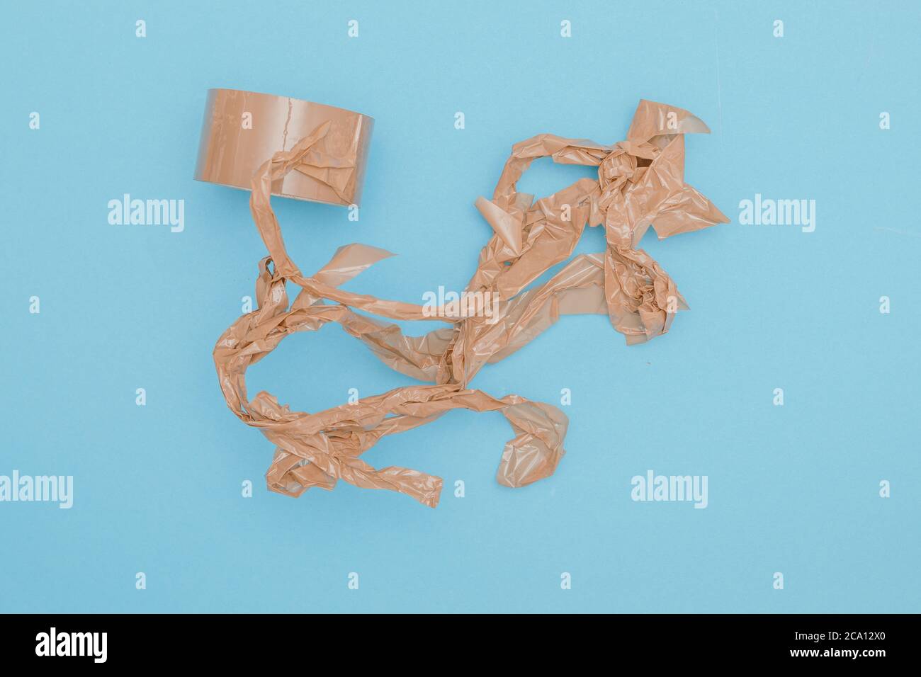 streched, crumpled and wrinkled parcel tape is a pain for every user Stock Photo