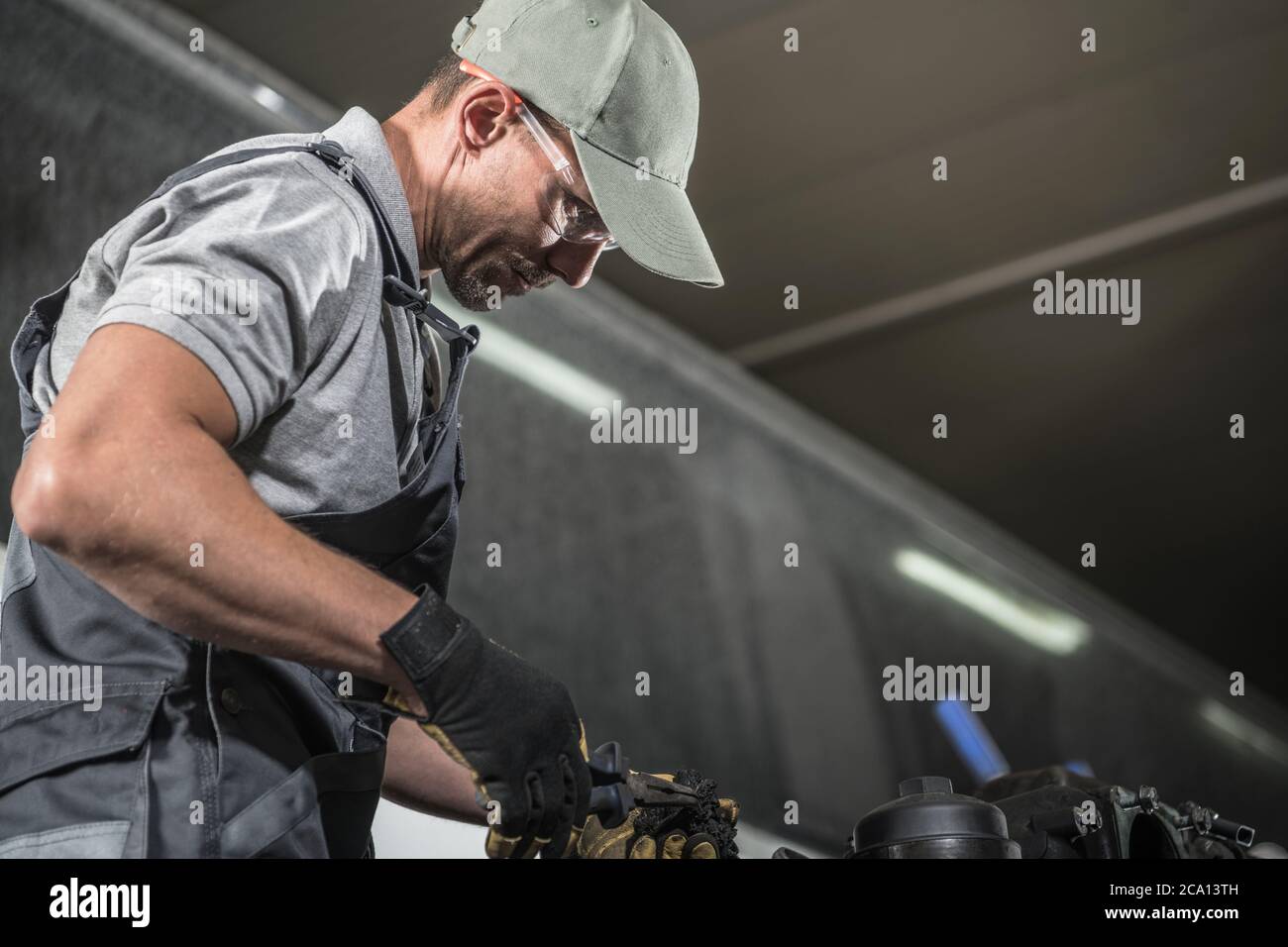 Caucasian Auto Service Worker in His 40s Wearing Eyes Safety Glasses