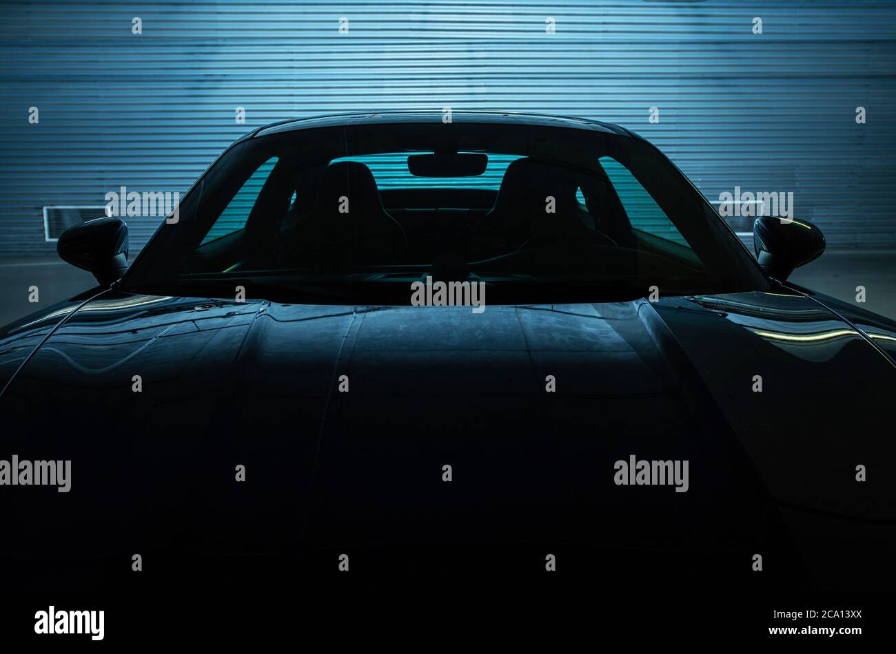 Exotic Supercar Parked in Underground Garage. Dark Blue Back