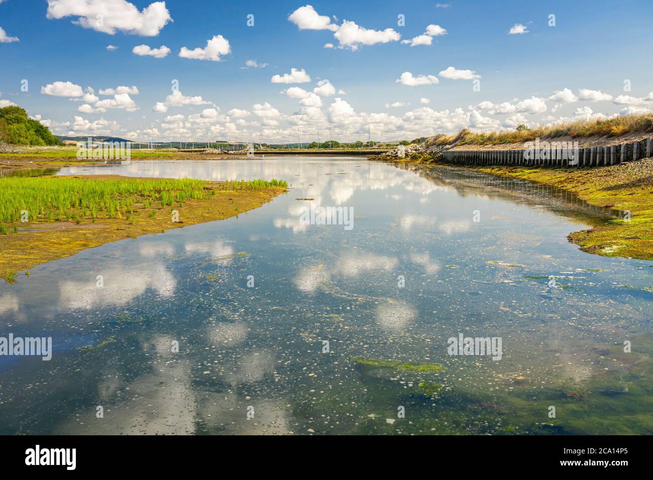 Clouds reflected in tidal pool Stock Photo