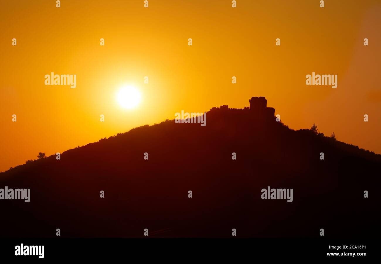 Silhouette of Trikotsova Castle near Haravgi village in Messinias region of the Peloponnese of Greece Stock Photo