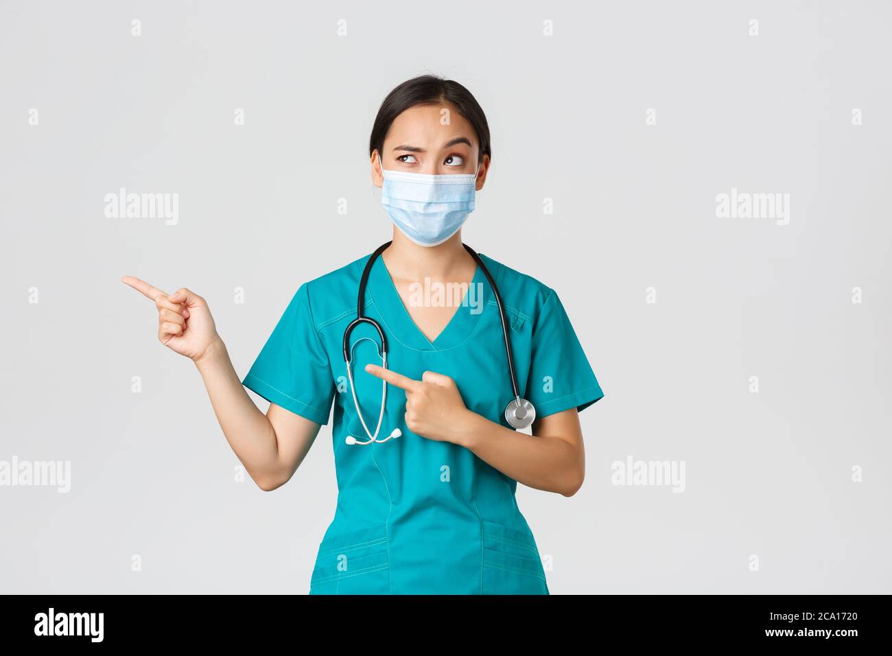 Suspicious looking doctor hi-res stock photography and images - Alamy