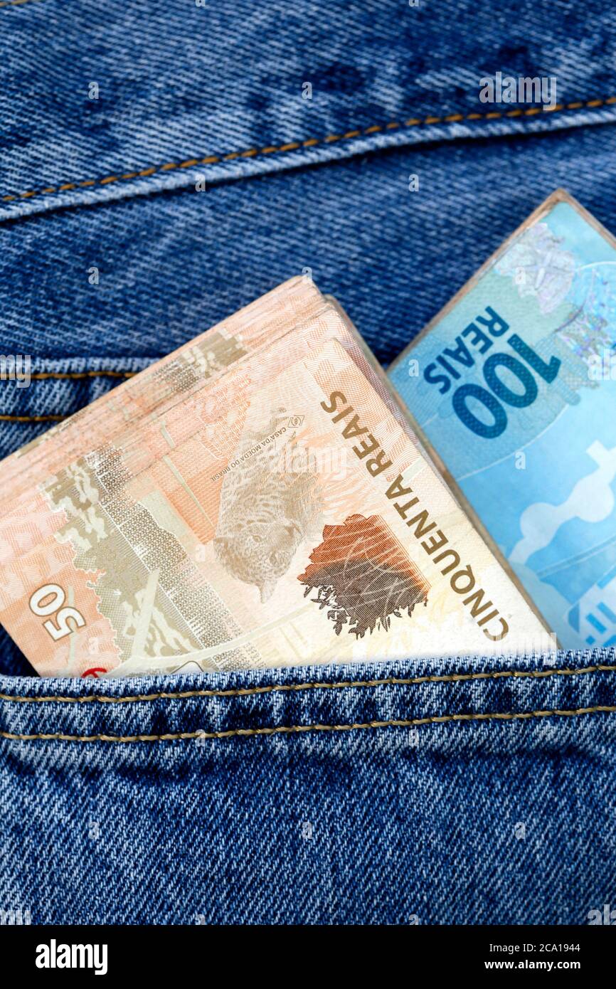 real, brazilian money, in the pocket of jeans Stock Photo - Alamy