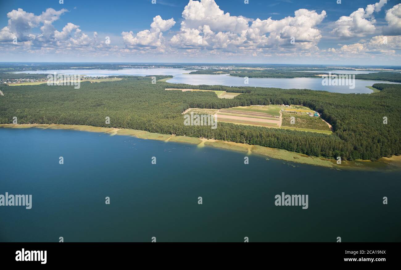 Lake shore in forest background aerial drone view Stock Photo